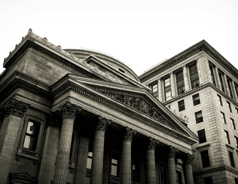 The columned facade of a bank building.